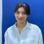 Expert Prompt Engineering and coding teacher – MyUstaza Online Learning Platform Professional South Asian female Prompt Engineering and coding teacher , smiling confidently in front of plants — expert online tutor at MyUstaza.