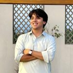 Expert Mental Maths Language Tutor – MyUstaza Online Learning Platform Professional South Asian male Mental Maths teacher wearing a hijab, smiling confidently in front of plants — expert online tutor at MyUstaza.