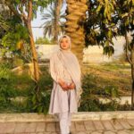 Expert Home work assistance, – MyUstaza Online Learning Platform Professional South Asian female Home work assistance, physiology teacher wearing a hijab, smiling confidently in front of plants — expert online tutor at MyUstaza.