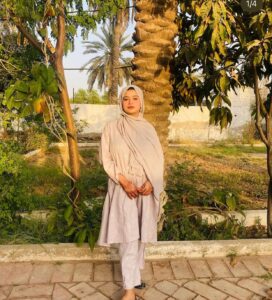 Expert Home work assistance, – MyUstaza Online Learning Platform Professional South Asian female Home work assistance, physiology teacher wearing a hijab, smiling confidently in front of plants — expert online tutor at MyUstaza.
