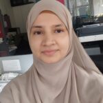 Expert Islamic scripture Tutor – MyUstaza Online Learning Platform Professional South Asian female Islamic Scripture teacher wearing a hijab, smiling confidently in front of plants — expert online tutor at MyUstaza.